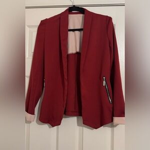 Red blazer with cream handfolds